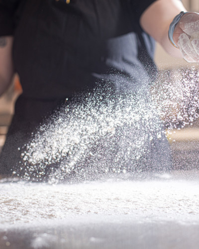 Best Places to Eat in Kilkenny - Chef Throwing Flour in Kitchen