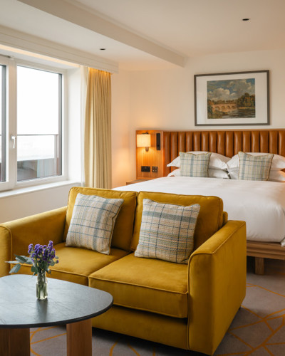 Kilkenny Suites with City View - Yellow Sofa in Hotel Bedroom