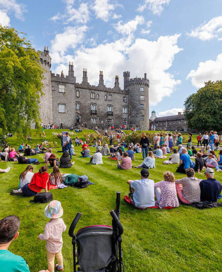 What to Do in Kilkenny - People Sitting on Kilkenny Castle Grounds